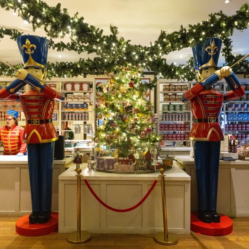 Giant toy soldiers and a decorated tree in the Christmas marketplace