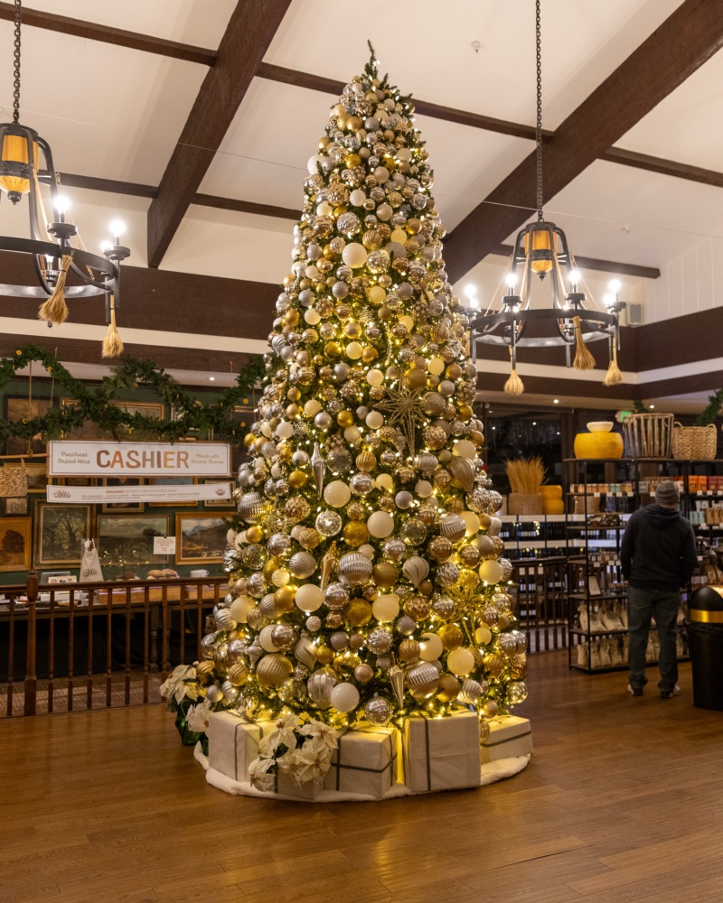 Towering gold and silver ornament tree inside the bread hall