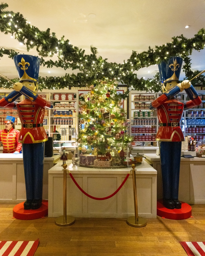Toy soldiers flanking a decorated tree in the lobby shop